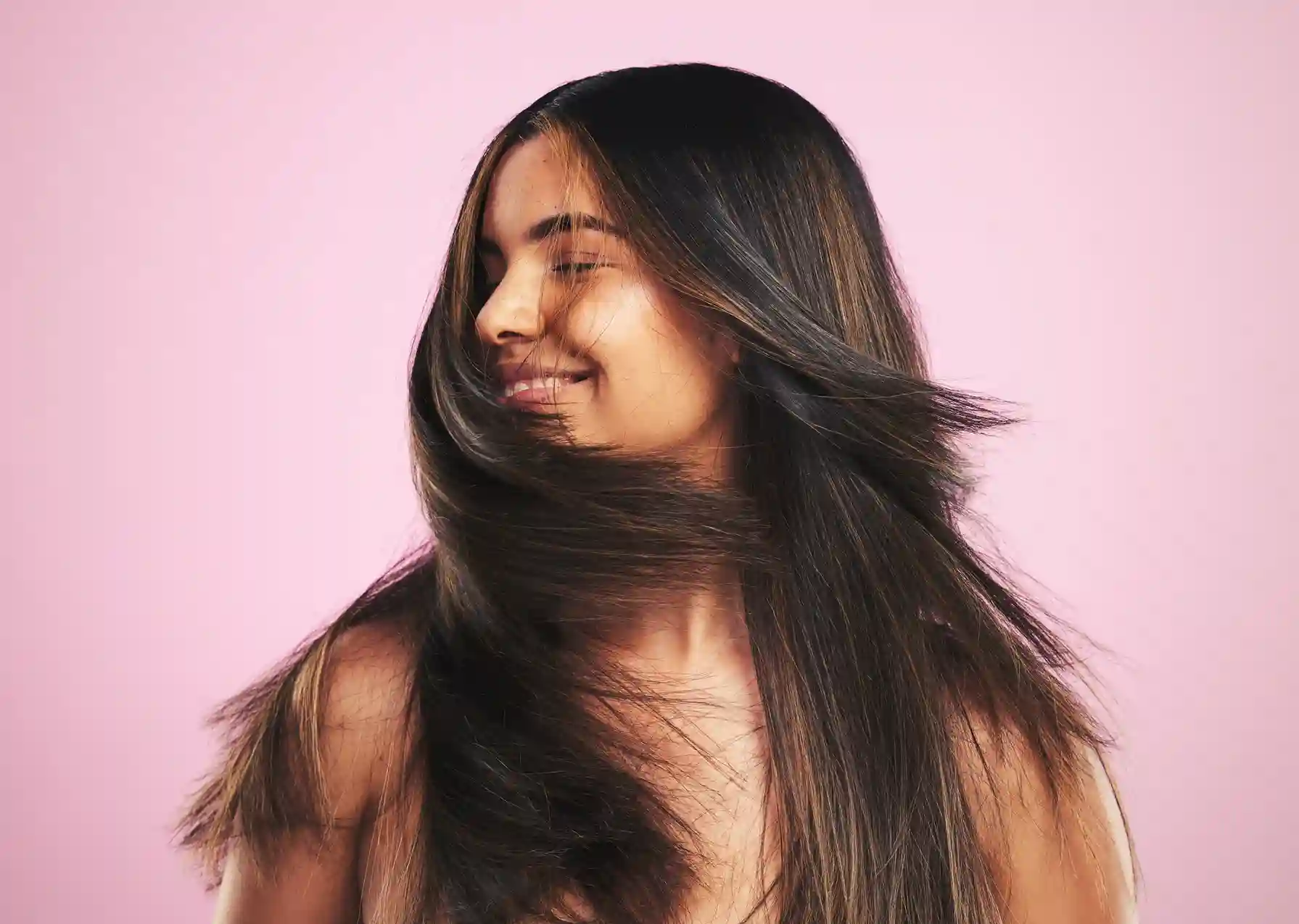 Woman flaunting open, layered hair after professional texturizing treatment