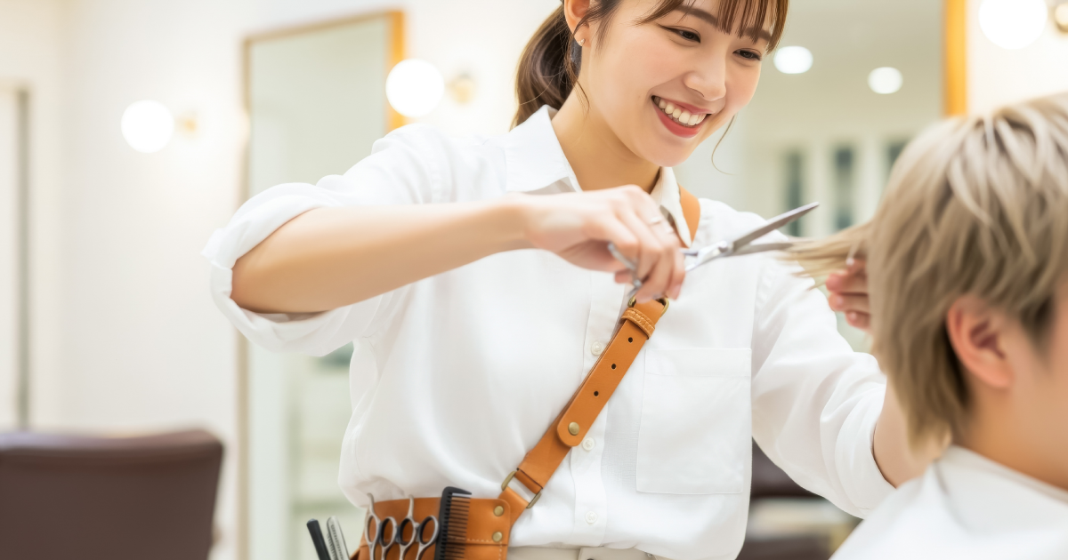Female Hairstylist Cutting Client’s Hair During Professional Salon Service in Cherry Hill, NJ, | Mora Salon